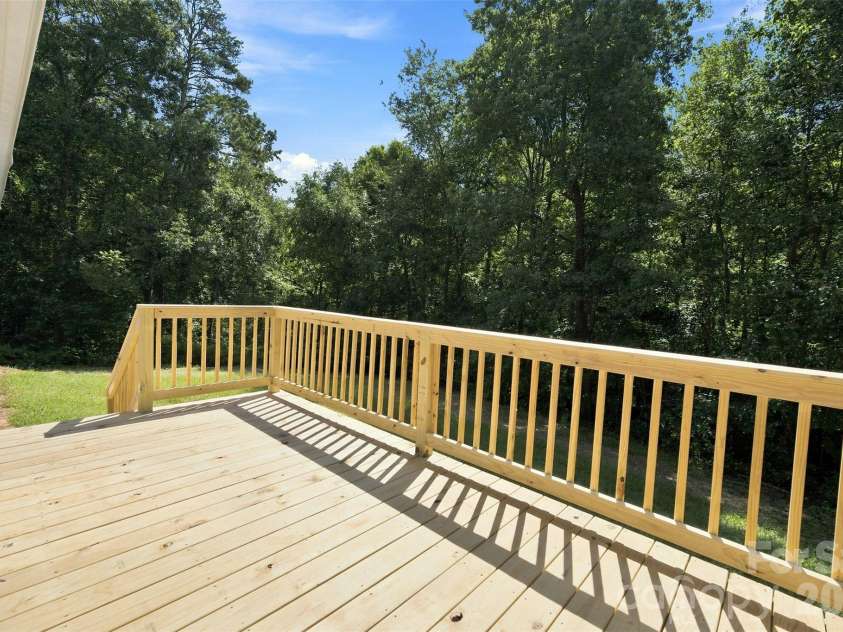 262 Upper Stanley Road, Stanley, NC 28164.  MLS# CAR4413693, YatesRealty ID 44776. Another view of new back deck overlooking private yard