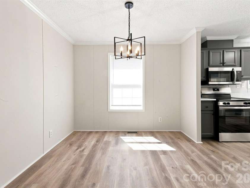 262 Upper Stanley Road, Stanley, NC 28164.  MLS# CAR4413693, YatesRealty ID 44776. Dining Room off Great Room & Kitchen.