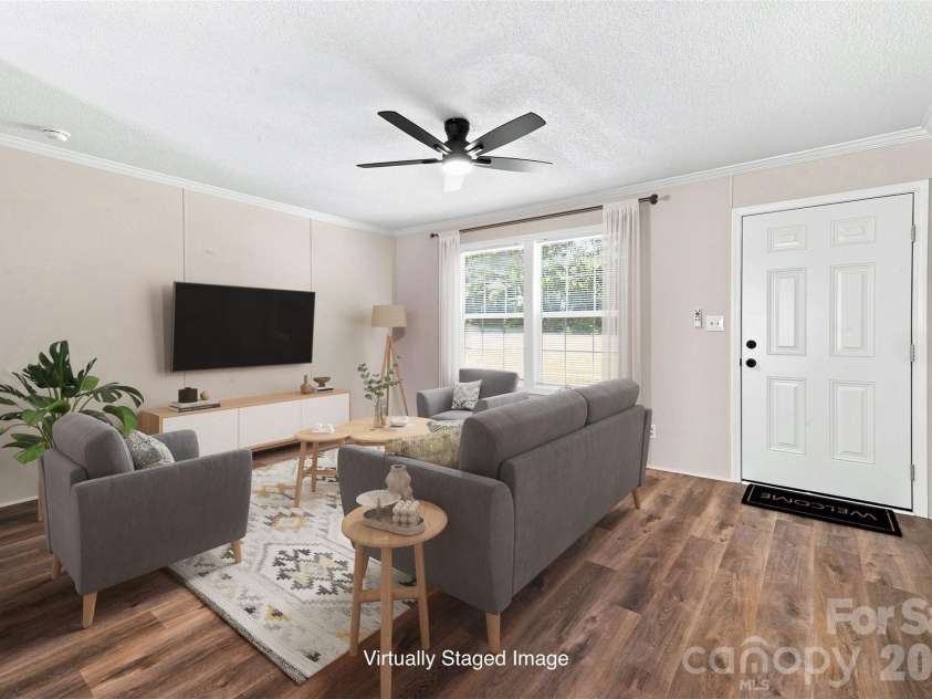 262 Upper Stanley Road, Stanley, NC 28164.  MLS# CAR4413693, YatesRealty ID 44776. Family Room Virtually Staged