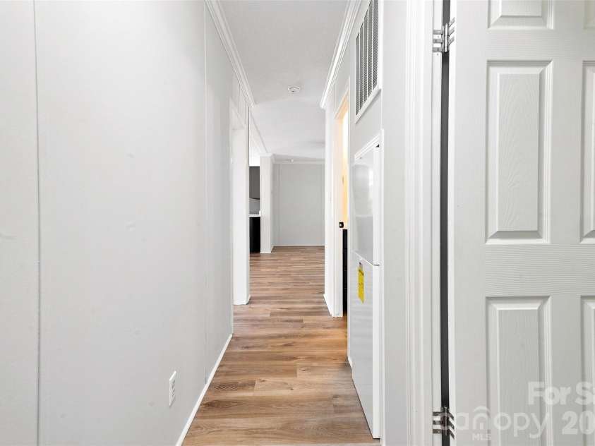 262 Upper Stanley Road, Stanley, NC 28164.  MLS# CAR4413693, YatesRealty ID 44776. Hallway leading to (3) secondary bedrooms.