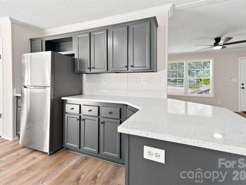 262 Upper Stanley Road, Stanley, NC 28164.  MLS# CAR4413693, YatesRealty ID 44776. More counterspace opposite side of sink and stove.