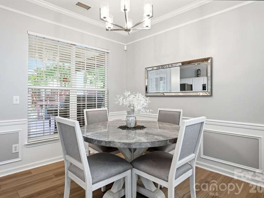 8530 Heron Glen Drive, Charlotte, NC 28269.  MLS# CAR4410893, YatesRealty ID 44779. Dining overlooking the private backyard