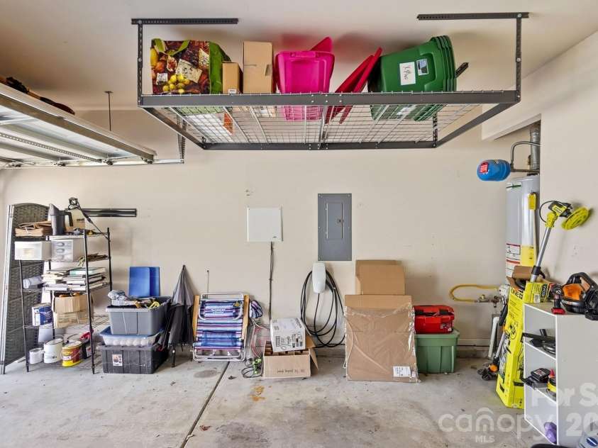 8530 Heron Glen Drive, Charlotte, NC 28269.  MLS# CAR4410893, YatesRealty ID 44779. Garage with Extra Storage & EV Charging STation