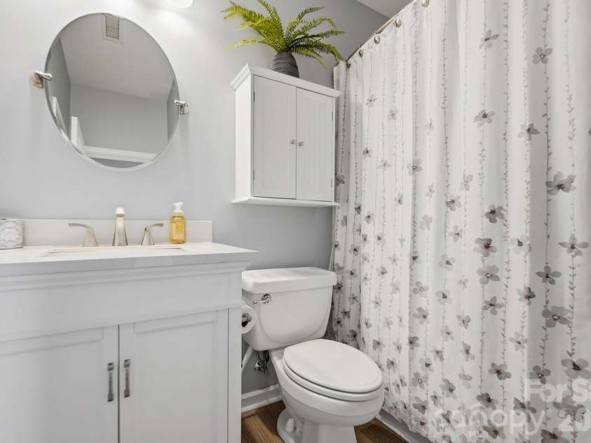 8530 Heron Glen Drive, Charlotte, NC 28269.  MLS# CAR4410893, YatesRealty ID 44779. Main Floor Hall Bath with updated Vanity.