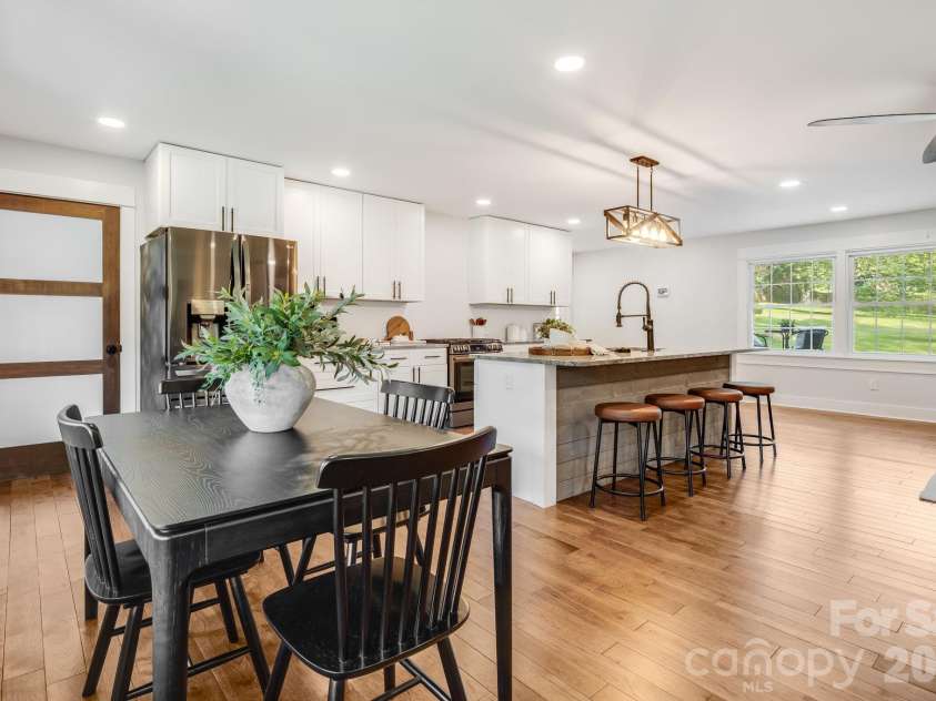 581 Old Leicester Highway, Asheville, NC 28806.  MLS# CAR4413183, YatesRealty ID 44785. Open dining area flows naturally into the kitchen, creating an inviting space for everyday meals and entertaining.