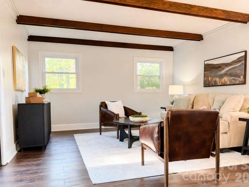 581 Old Leicester Highway, Asheville, NC 28806.  MLS# CAR4413183, YatesRealty ID 44785. Versatile den or flex space with engineered flooring and exposed beams, ideal for a second living area, media room or home office.