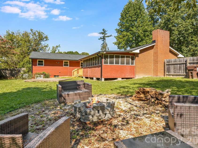 376 School Road, Asheville, NC 28803.  MLS# CAR4421506, YatesRealty ID 44798. Fire Pit in Back Yard