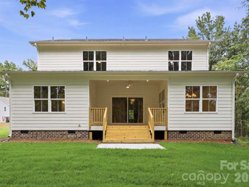 2311 Chateau Court, Matthews, NC 28105.  MLS# CAR4407256, YatesRealty ID 44799. Daytime rear view.