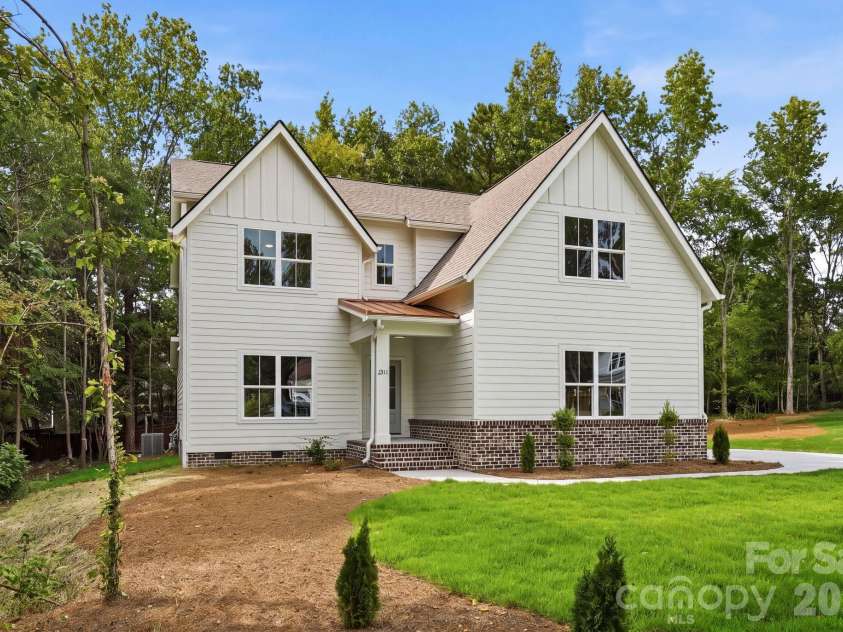 2311 Chateau Court, Matthews, NC 28105.  MLS# CAR4407256, YatesRealty ID 44799. Daytime side view.