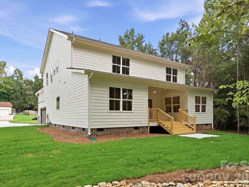 2311 Chateau Court, Matthews, NC 28105.  MLS# CAR4407256, YatesRealty ID 44799. Daytime side view.