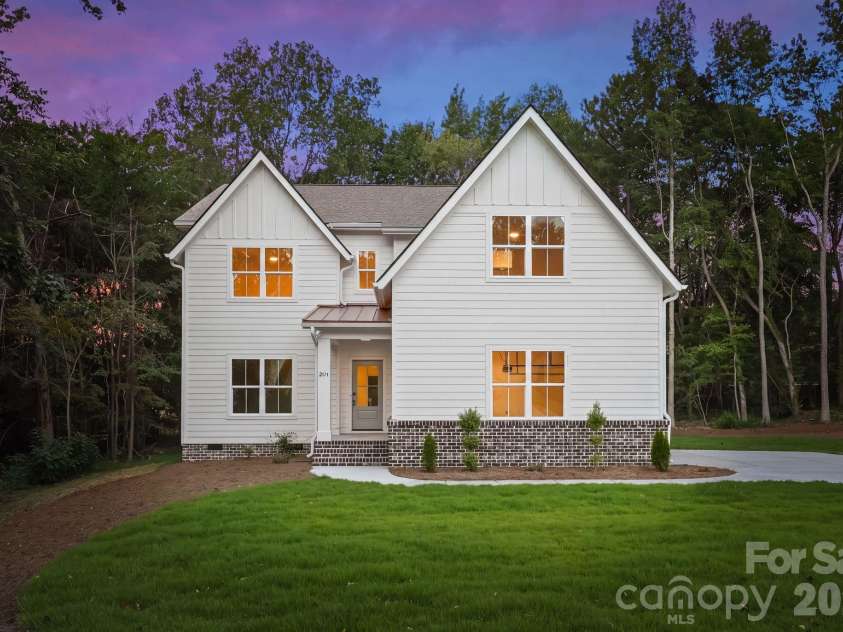 2311 Chateau Court, Matthews, NC 28105.  MLS# CAR4407256, YatesRealty ID 44799. Front exterior view at twilight.