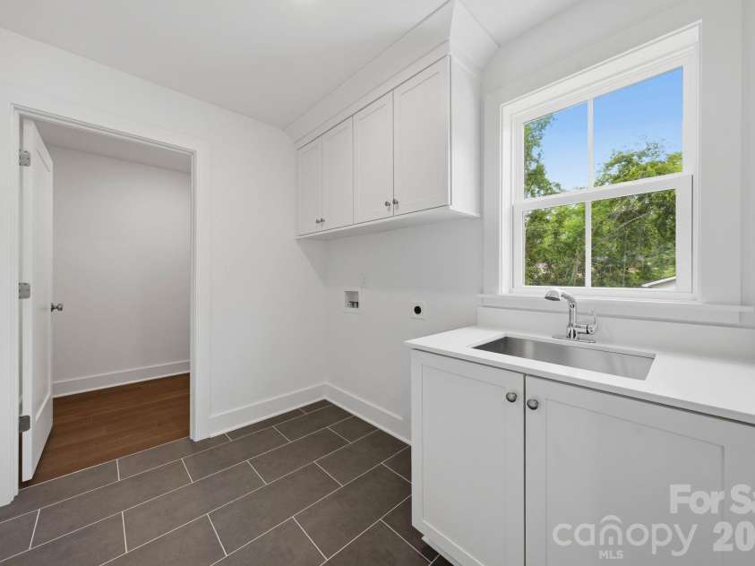 2311 Chateau Court, Matthews, NC 28105.  MLS# CAR4407256, YatesRealty ID 44799. Laundry room.