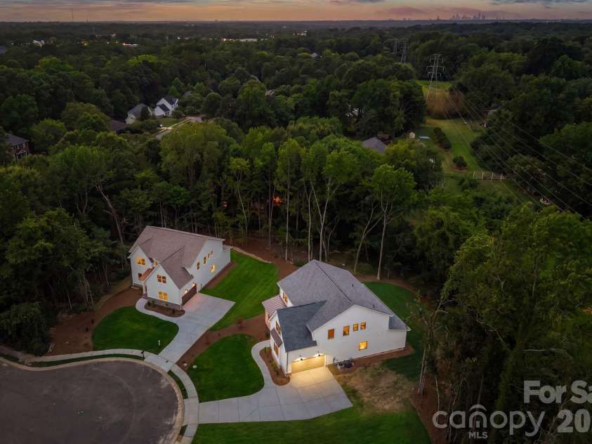 2315 Chateau Court, Matthews, NC 28105.  MLS# CAR4407259, YatesRealty ID 44800. Aerial twilight view.
