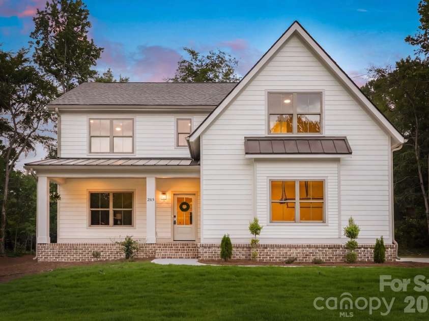 2315 Chateau Court, Matthews, NC 28105.  MLS# CAR4407259, YatesRealty ID 44800. Exterior front view at twilight.