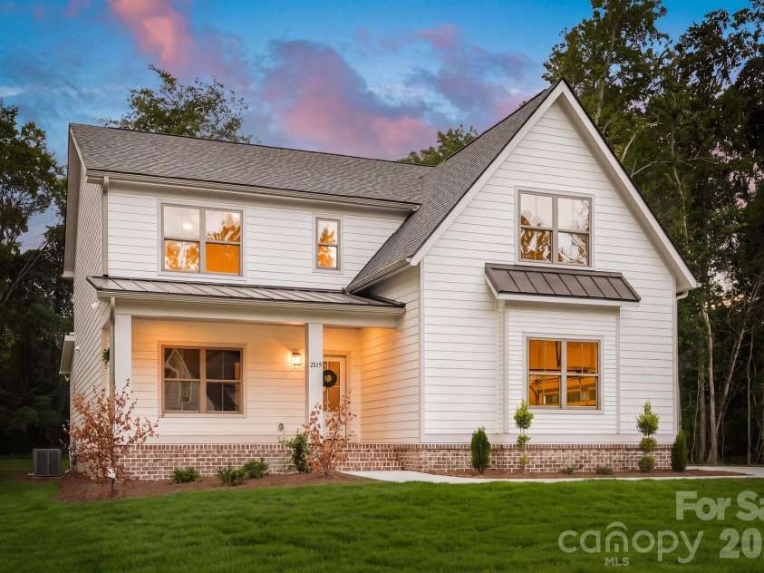 2315 Chateau Court, Matthews, NC 28105.  MLS# CAR4407259, YatesRealty ID 44800. Exterior side view at twilight.