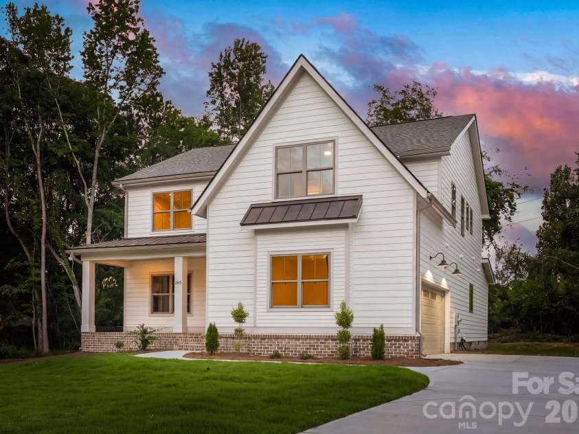 2315 Chateau Court, Matthews, NC 28105.  MLS# CAR4407259, YatesRealty ID 44800. Exterior side view at twilight.