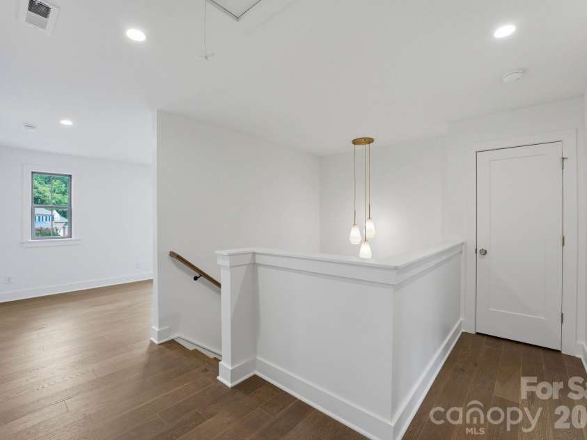 2315 Chateau Court, Matthews, NC 28105.  MLS# CAR4407259, YatesRealty ID 44800. Upper level landing.