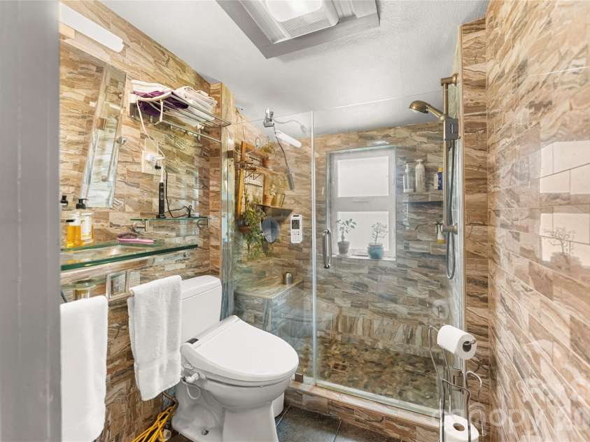 620 Old Lytle Cove Road, Swannanoa, NC 28778.  MLS# CAR4415136, YatesRealty ID 44806. Upstairs bath with step in shower