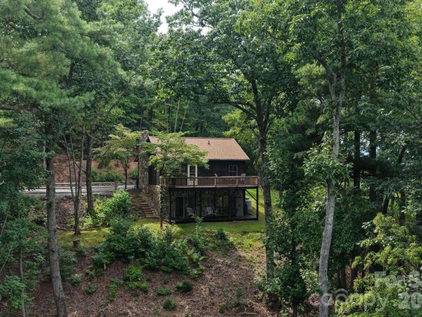 345 Chalk Dust Trail, Purlear, NC 28665.  MLS# CAR4415020, YatesRealty ID 44809. Beautifully Tucked in The Woods