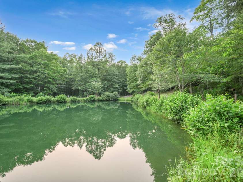 345 Chalk Dust Trail, Purlear, NC 28665.  MLS# CAR4415020, YatesRealty ID 44809. Stocked Community Pond