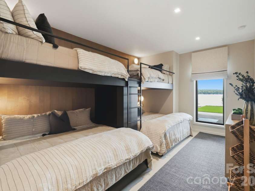 123 Cove Point, Mount Gilead, NC 27306.  MLS# CAR4408189, YatesRealty ID 44817. Bunk room with four built-in beds (lower level)