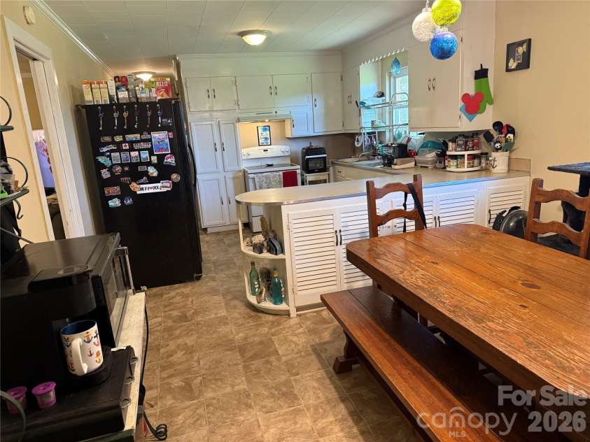 2175 Triplett Road, Mt Ulla, NC 28125.  MLS# CAR4415272, YatesRealty ID 44818. Dining area + Kitchen