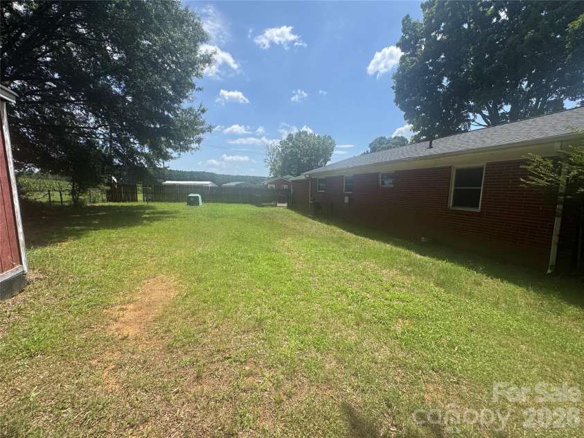 2175 Triplett Road, Mt Ulla, NC 28125.  MLS# CAR4415272, YatesRealty ID 44818. Large backyard