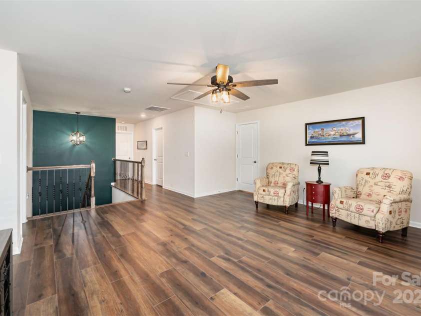1051 Lookout Shoals Drive, Fort Mill, SC 29715.  MLS# CAR4222088, YatesRealty ID 4482. Open loft area with wide plank wood floors across entire second floor