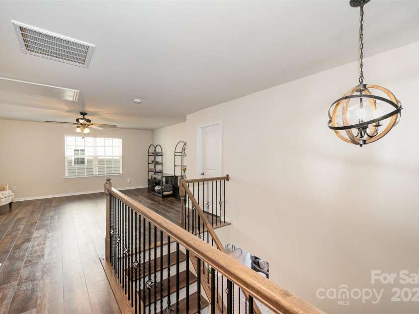 1051 Lookout Shoals Drive, Fort Mill, SC 29715.  MLS# CAR4222088, YatesRealty ID 4482. Stairs with wood treads