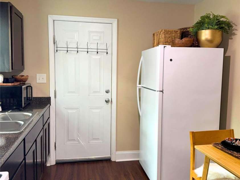 1801 Purser Drive, Charlotte, NC 28215.  MLS# CAR4414235, YatesRealty ID 44823. Kitchen. View into kitchen and backdoor exit.