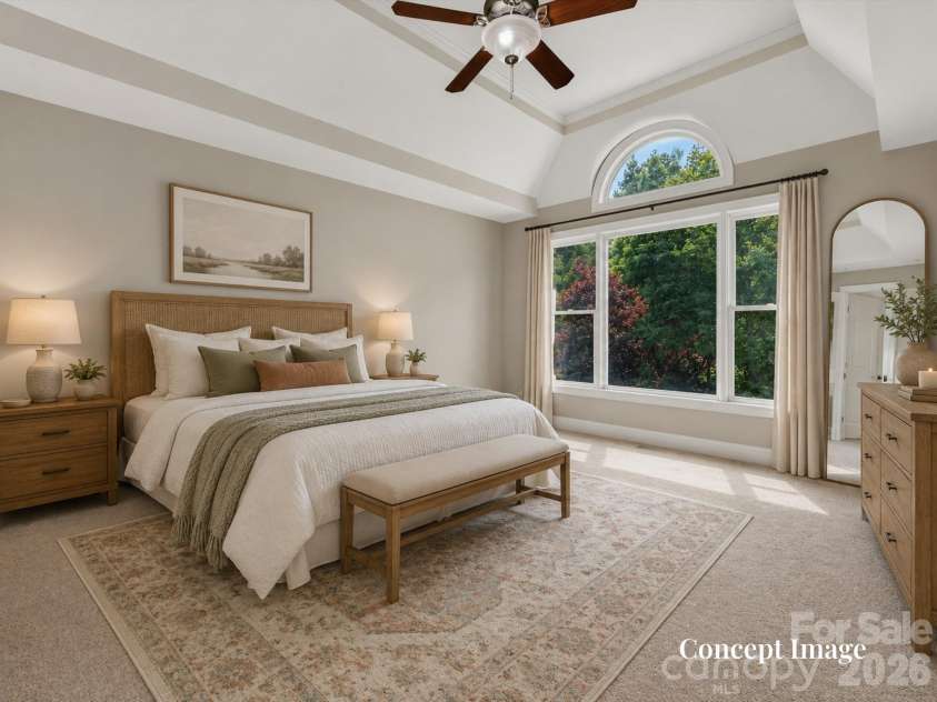 447 Three Greens Drive, Huntersville, NC 28078.  MLS# CAR4414048, YatesRealty ID 44824. Concept Photo (virtually staged) - Spacious primary suite features a tray ceiling, oversized windows, abundant natural light, and a private ensuite bath.