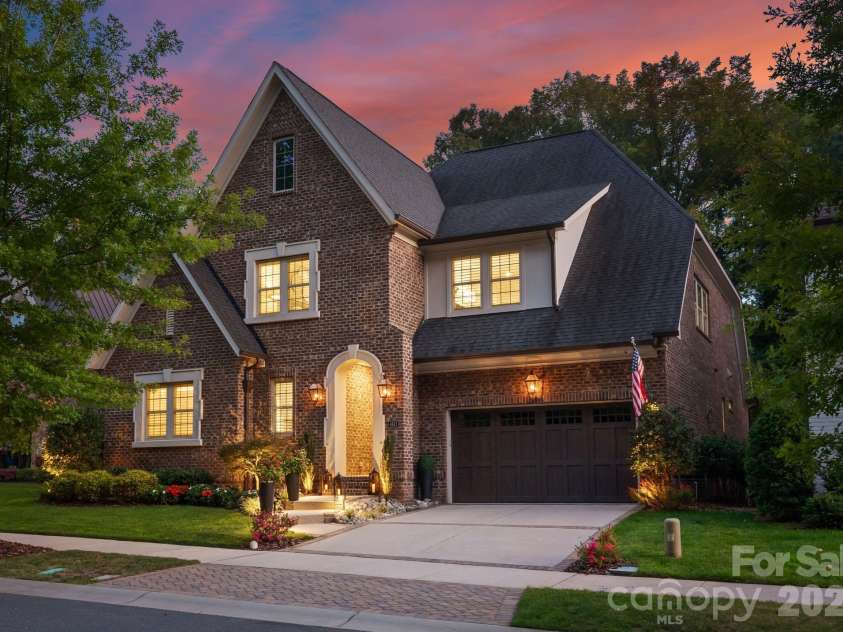 4611 Harper Court, Charlotte, NC 28210.  MLS# CAR4413590, YatesRealty ID 44828. Side view at twilight.