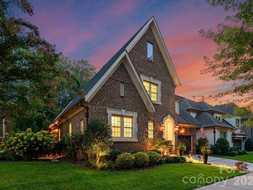 4611 Harper Court, Charlotte, NC 28210.  MLS# CAR4413590, YatesRealty ID 44828. Side view at twilight.