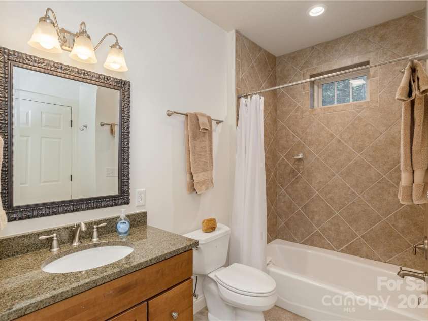 23 Dartmoor Court, Flat Rock, NC 28731.  MLS# CAR4241308, YatesRealty ID 4483. Guest Bathroom 2