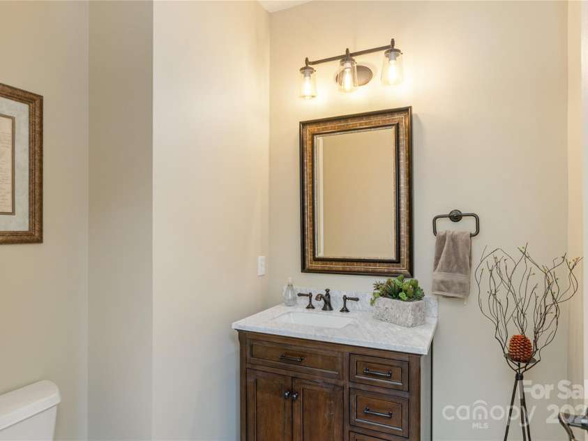 23 Dartmoor Court, Flat Rock, NC 28731.  MLS# CAR4241308, YatesRealty ID 4483. Main Level Powder Room