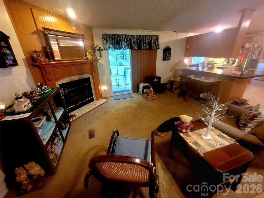 121 Sylvan Drive, Statesville, NC 28677.  MLS# CAR4414812, YatesRealty ID 44831. Den & fireplace