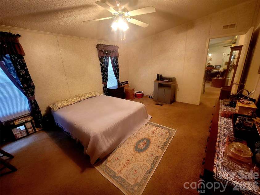 121 Sylvan Drive, Statesville, NC 28677.  MLS# CAR4414812, YatesRealty ID 44831. Primary bedroom