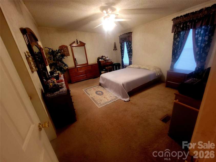 121 Sylvan Drive, Statesville, NC 28677.  MLS# CAR4414812, YatesRealty ID 44831. Primary bedroom
