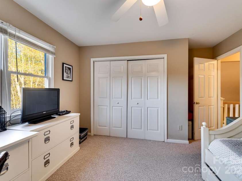 180 Paw Paw Cove, Sylva, NC 28779.  MLS# CAR4321416, YatesRealty ID 4484. Upstairs Right Bedroom