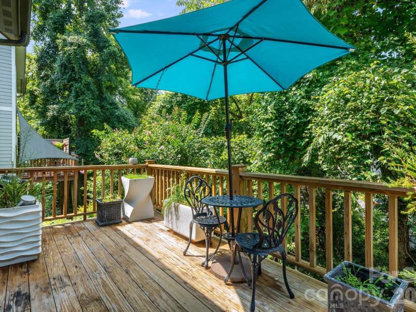 35 Emmett Lane, Asheville, NC 28806.  MLS# CAR4348992, YatesRealty ID 44840. Back deck off the first floor.