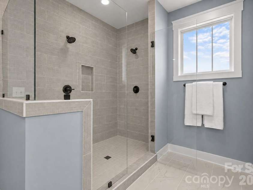 3031 Grandiose Drive, Indian Trail, NC 28079.  MLS# CAR4411902, YatesRealty ID 44844. Owner's Bath Shower - Model Home, For Reference Only.