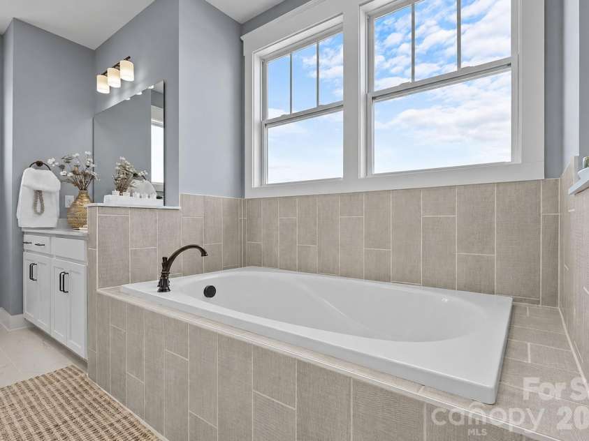 3031 Grandiose Drive, Indian Trail, NC 28079.  MLS# CAR4411902, YatesRealty ID 44844. Owner's Bath Soaking Tub - Model Home, For Reference Only.