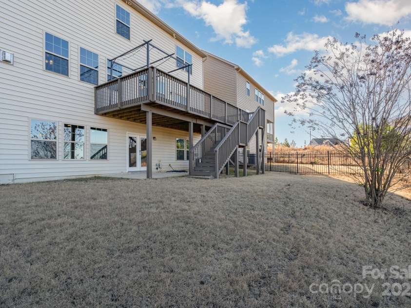 1878 Sapphire Meadow Drive, Fort Mill, SC 29715.  MLS# CAR4209802, YatesRealty ID 4485. Large, fenced back yared