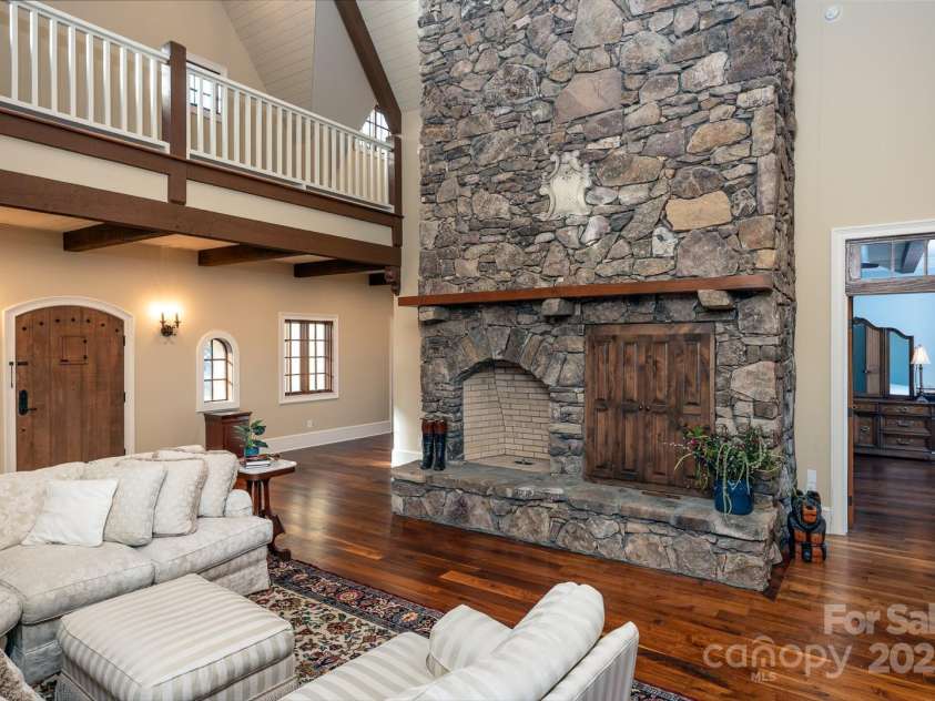 628 Rock Ledge Lane, Linville, NC 28646.  MLS# CAR4230974, YatesRealty ID 4486. Two Story Stone Fireplace