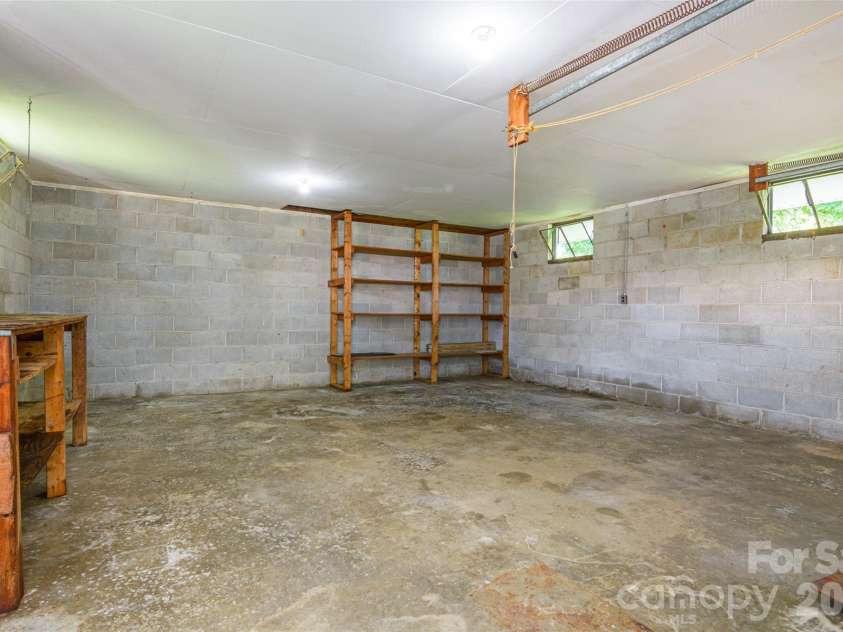 32 Kathy Drive, Waynesville, NC 28786.  MLS# CAR4411160, YatesRealty ID 44862. Workshop Interior