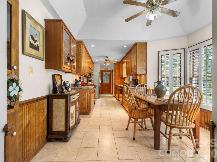 1316 Oak Canopy Road, Lincolnton, NC 28092.  MLS# CAR4415317, YatesRealty ID 44866. Tray ceiling opens the dining area, built in display cabinets