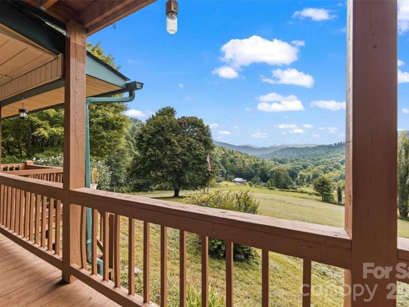 263 Pilgrims Lane, Burnsville, NC 28714.  MLS# CAR4415371, YatesRealty ID 44896. Front Porch with long range views