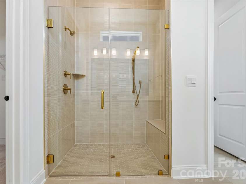 2250 Whitebark Drive, Indian Land, SC 29707.  MLS# CAR4415447, YatesRealty ID 44919. Primary bathroom zero entry shower virtually staged