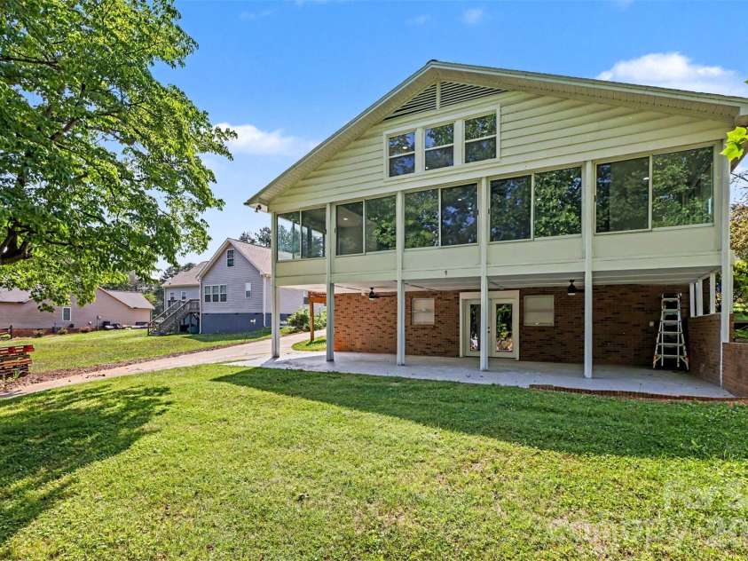 6917 Navajo Trail, Sherrills Ford, NC 28673.  MLS# CAR4394650, YatesRealty ID 44932. Back of home overlooking lake