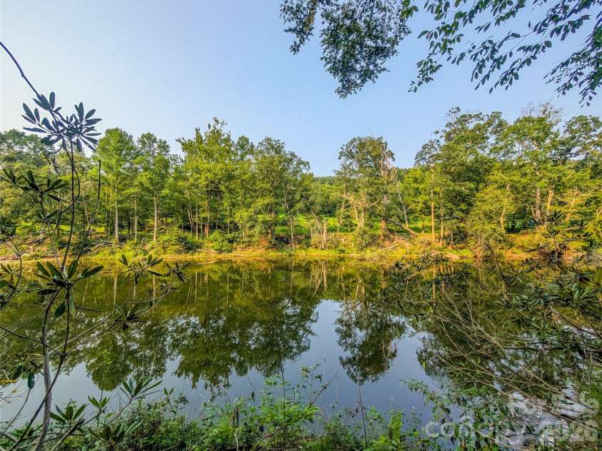 328 Wooded Valley Lane, Burnsville, NC 28714.  MLS# CAR4409092, YatesRealty ID 44933. South Toe River Frontage!